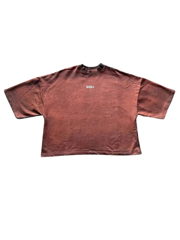 Maglia oversize a maniche 3/4 color ruggine con piccola stampa KORDA sul petto, capo piegato